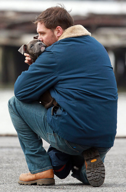 Tom Hardy Huddling with His Puppy