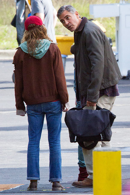 Superstar actor George Clooney on the Vancouver set of Tomorrowland. George films an outdoor scene having a heated discussion with Britt Robertson as Raffey Cassidy looks on. Also photographed is Clooney talking with director Brad Bird.